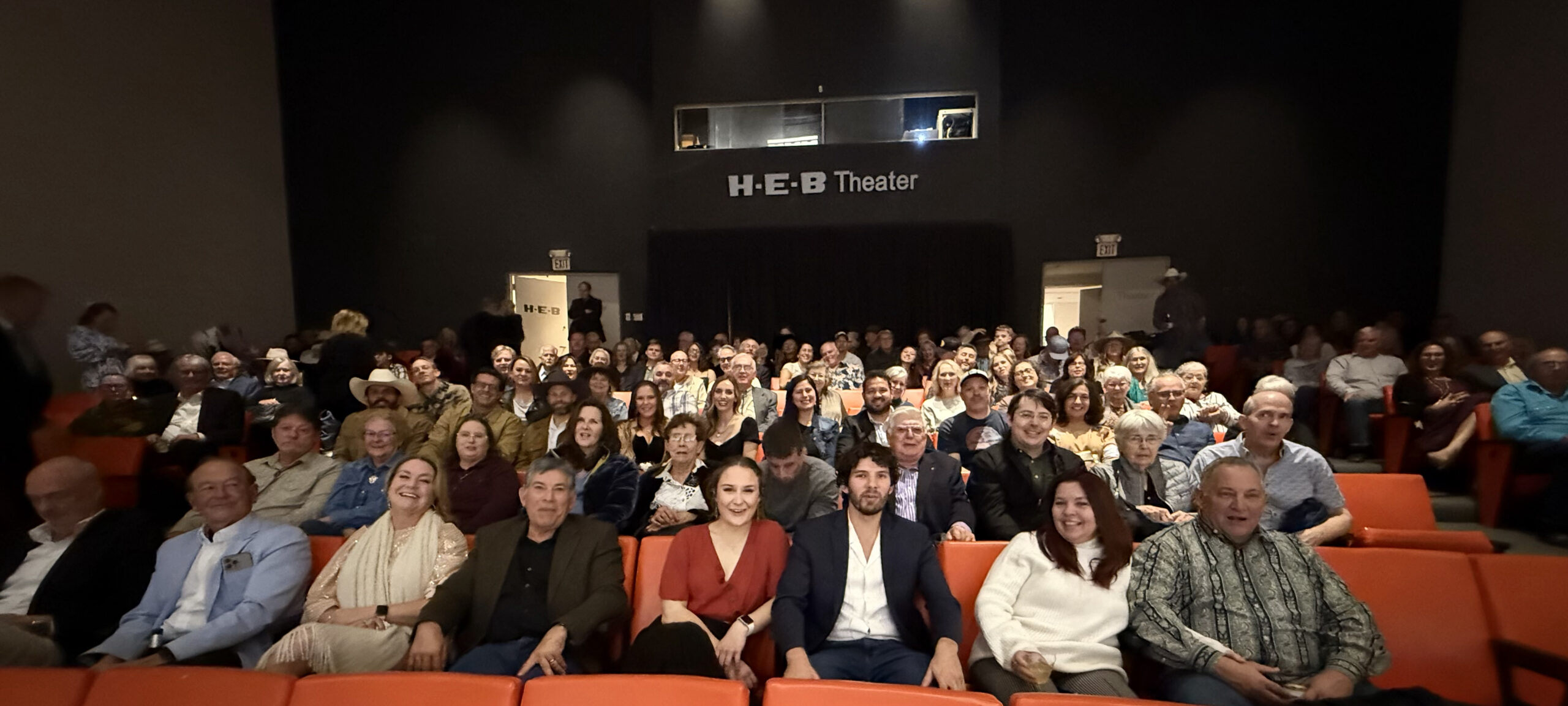 Audience seated in H-E-B Theater