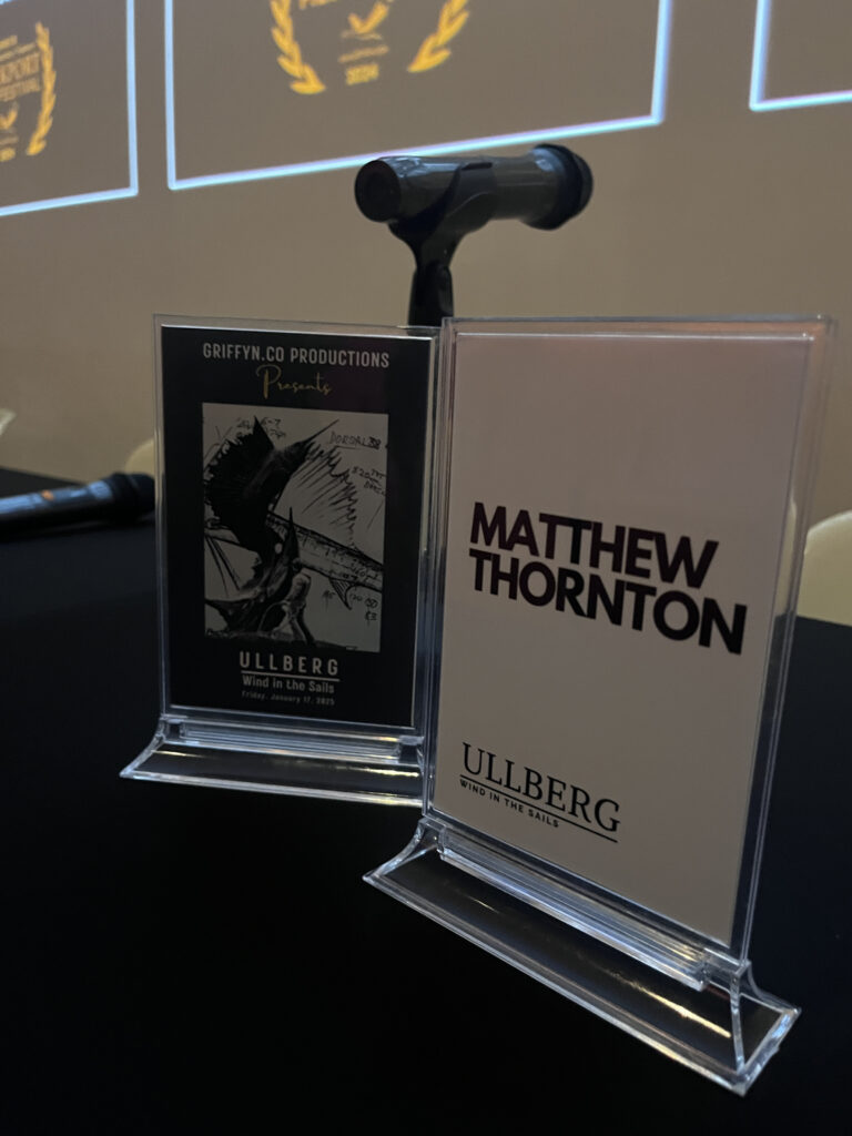 Microphone and display stands at a presentation event.