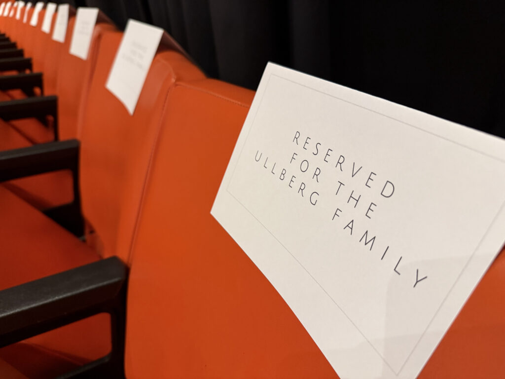 Reserved seats with name tags on them.
