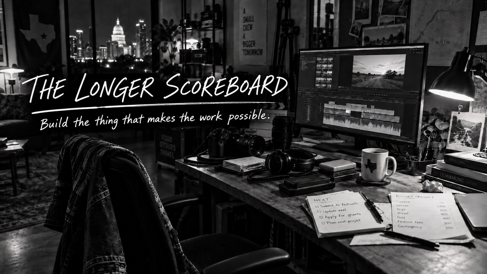 Black-and-white image of a filmmaker’s nighttime workspace in Austin, with editing equipment, notes, and the handwritten title “The Longer Scoreboard.”